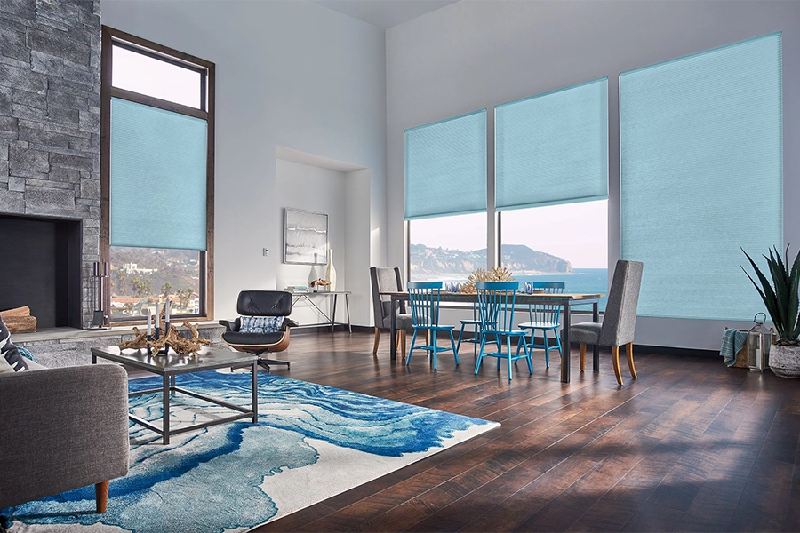 Smart motorized window shades are perfect on tall windows in your Cincinnati home. Blue motorized shades on tall living room windows