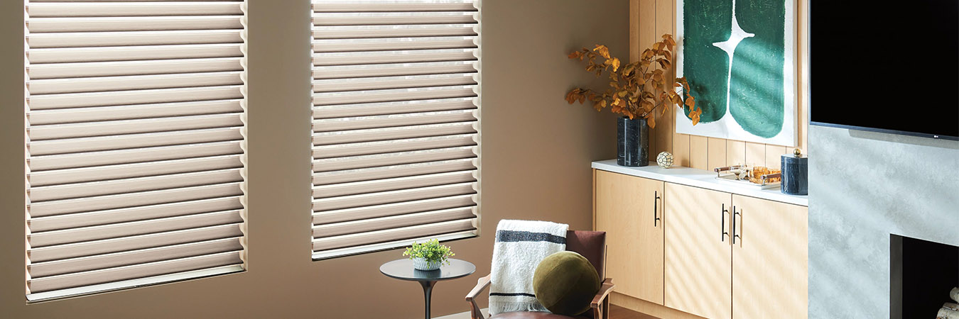 wood blinds beige living room with green decor 