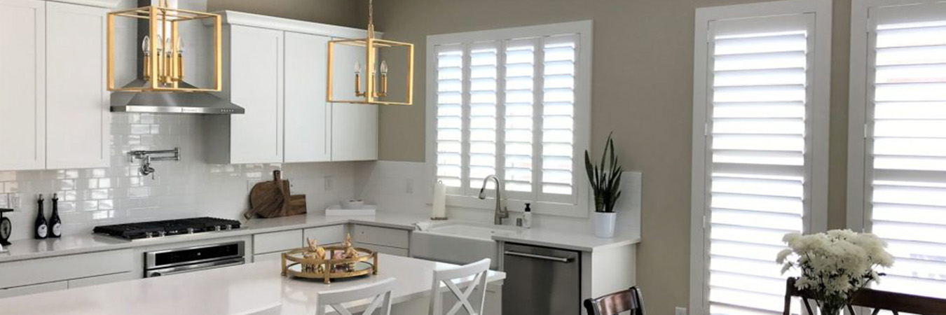 White Polywood shutters on a kitchen window and door