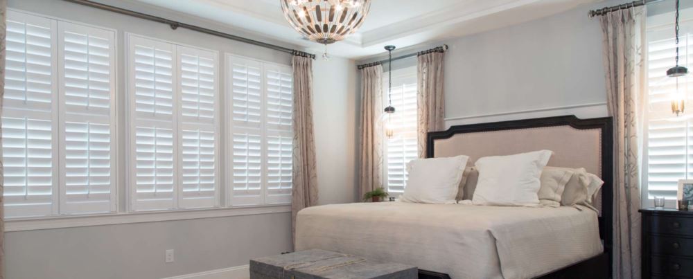 Polywood shutters in a master bedroom suite
