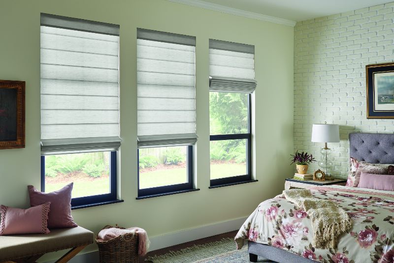 Roman shades in a bedroom
