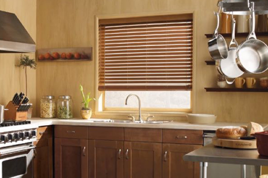 Blinds won't warp when installed over sinks or other rooms with humidity.  faux-wood blinds stained light oak
