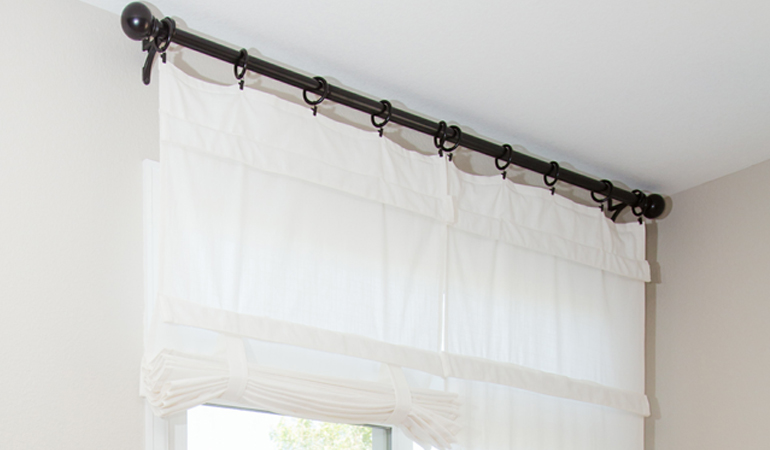 Tumble shades in Cincinnati give your doors privacy versatility and style. White tumble shade on double glass doors