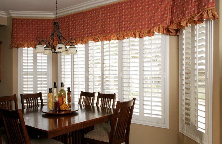 Plantation shutters on wide kitchen windows